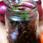 caramelized onion in a jar with parsley on top