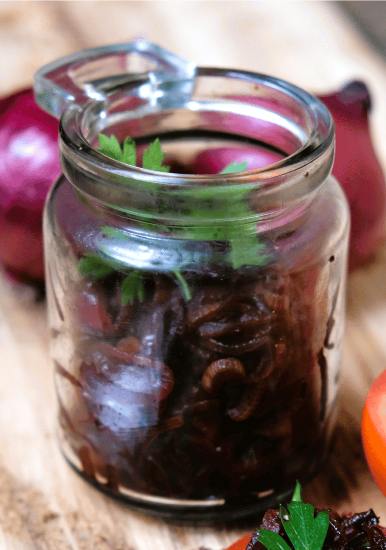 caramelized onion in a jar with parsley on top