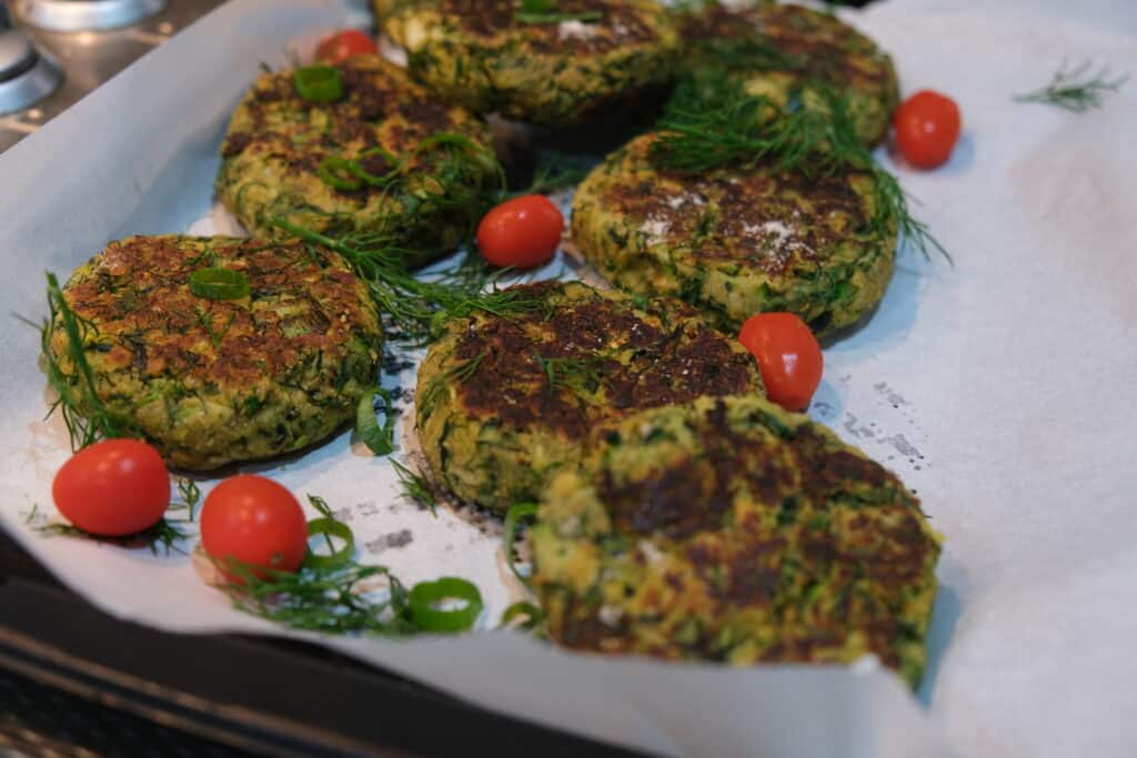 zucchini fritters on baking tray