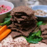 crackers in a stack with veggies and dip