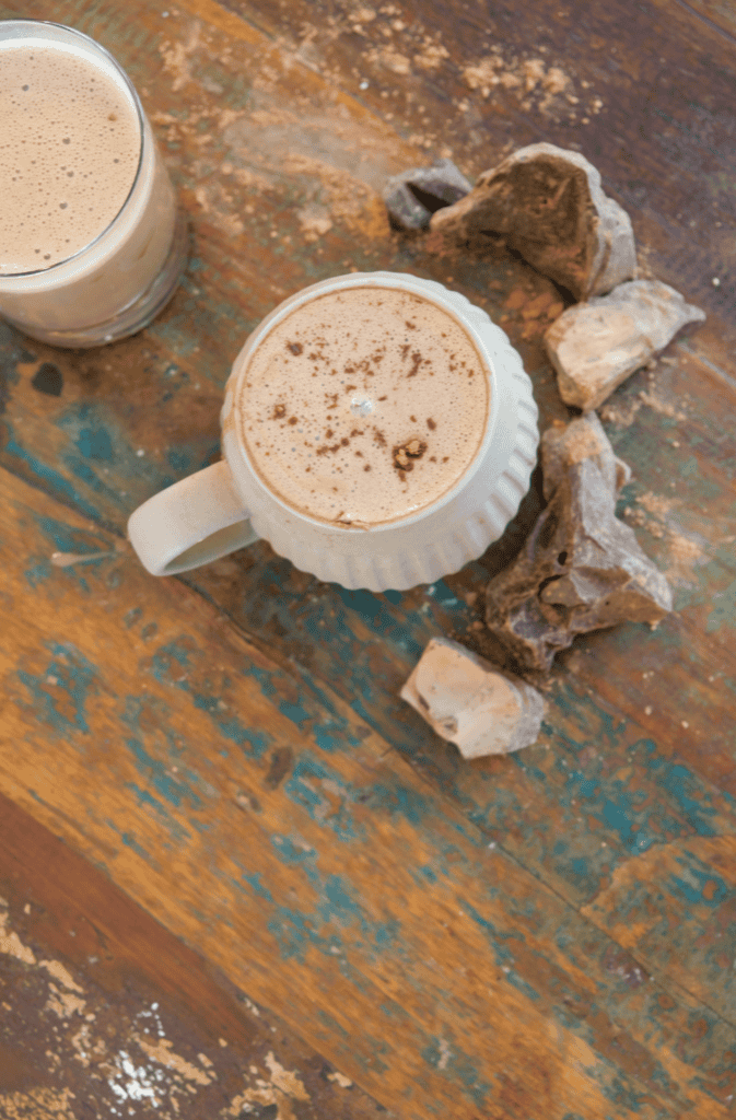 hot chocolate with big chocolate chunks on a wood table