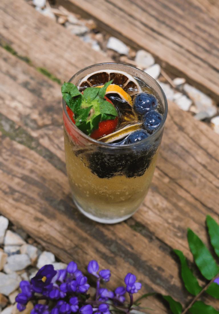 iced tea with orange, mint, blueberries and strawberries