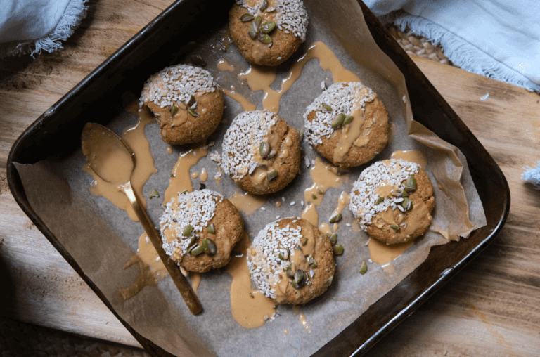 tahini cookies drizzled with extra tahini, sesame and pumpkin seeds