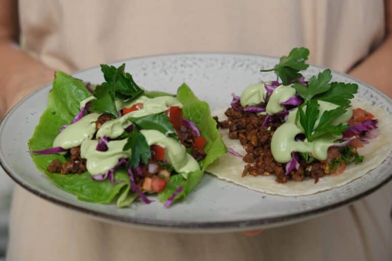 walnut mince tacos - on in lettuce cup and another in tortilla on a plate