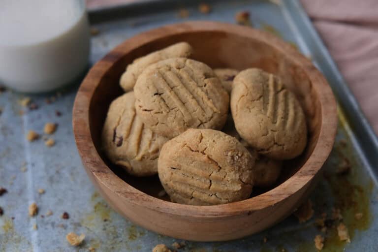 Peanut butter chickpea cookies in a bowl with oat milk