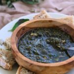 sunflower seed pesto with sourdough bread on white plate
