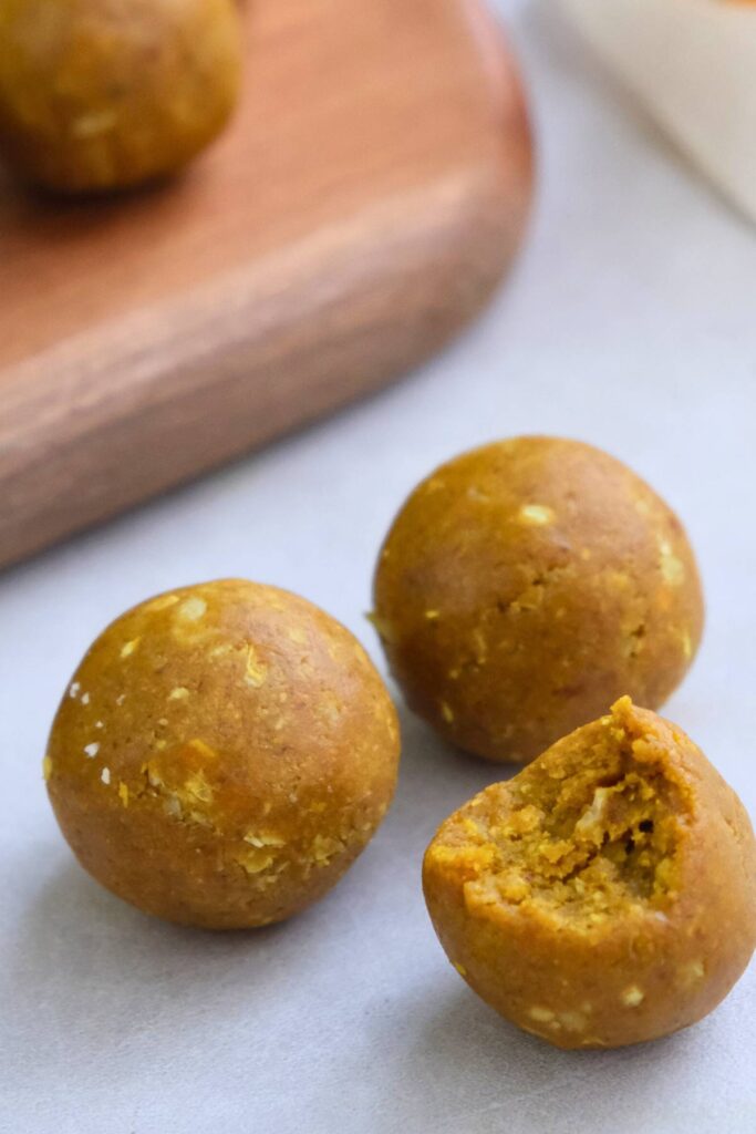 close up shot of turmeric balls with a bite taken out